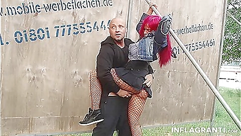 Hot redhead in stockings with big tits is showing her milf body