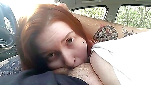 Redhead babe gets her mouth sucked on a high end car