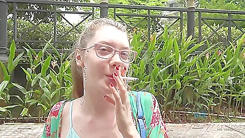 Curly-haired brunette pissing in the shower in the bathroom