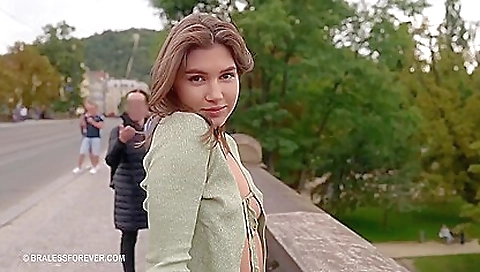 Brunette naked in bikini and outdoors on the beach