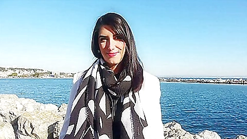 A hot brunette babe with big boobs is showing her off