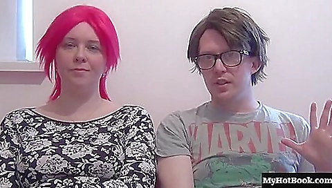 Redhead with large tits is on the bed in black stockings