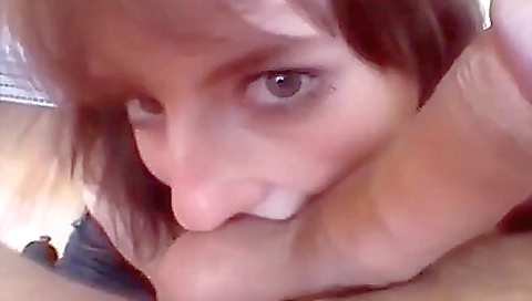 Redhead with large tits receives a good handjob on the bed